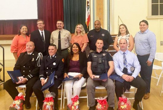 Public Safety honorees sit for a portrait following the public safety employees luncheon.